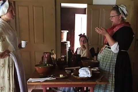 Colonial Women at a table